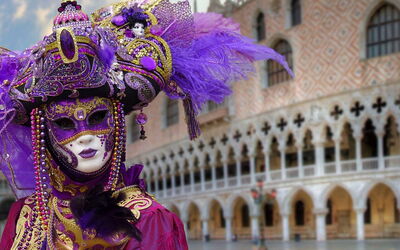 Person wearing a carnival mask in Venice