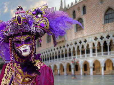 Person wearing a carnival mask in Venice