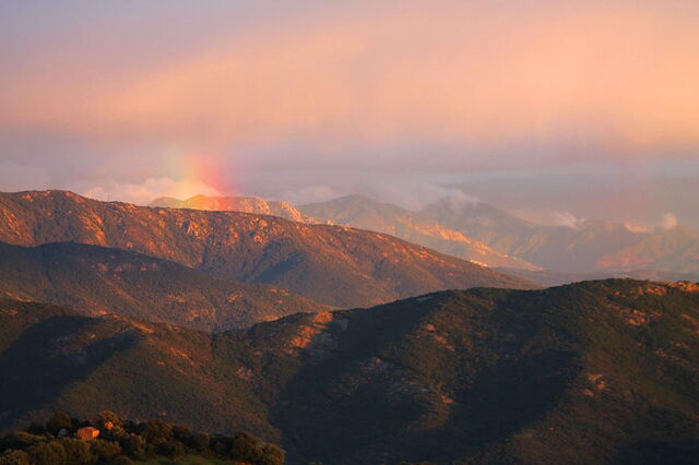 A rainbow over mountains, Corsica