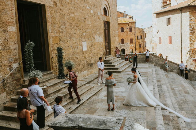 A bride on church steps in Italy