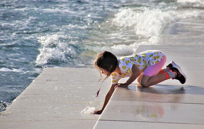 Girl at Zadar's Sea Organ