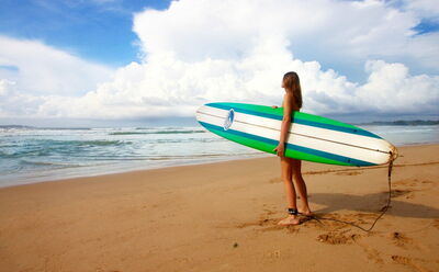 Woman with a surfboard