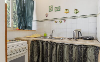 Cicladi Mikonos 100.4: Interior Design, Furniture, Flooring, Kitchen, Major Appliance, Room, Floor, Countertop, Kitchen Appliance, Home Appliance
