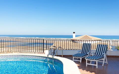 Stella: Sky, Water, Property, Furniture, Blue, Seaside Resort, Swimming Pool, Outdoor Furniture, Sunlounger, Leisure