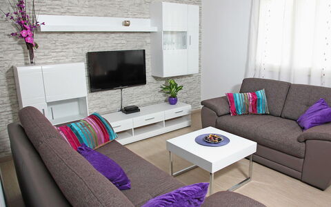 Vinka: Furniture, Couch, Property, Purple, Plant, Table, Comfort, Studio Couch, Houseplant, Living Room