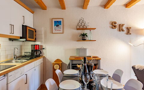 Les Huskies: Property, Furniture, Cabinetry, Picture Frame, Table, Chair, Sink, Interior Design, Wood, Building