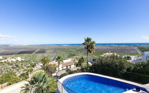 Villa Flores: Sky, Water, Plant, Building, Property, Seaside Resort, Azure, Tree, House, Swimming Pool