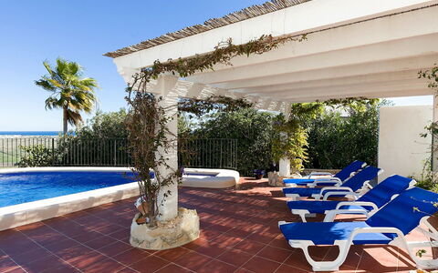 Villa Flores: Plant, Water, Sky, Property, Blue, Azure, Shade, Outdoor Furniture, Architecture, Swimming Pool