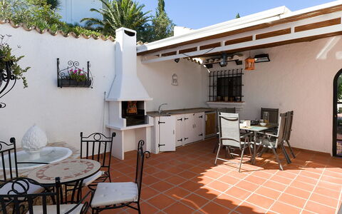 Villa Flores: Table, Furniture, Property, Chair, Sky, Window, Flowerpot, Interior Design, Building, Lighting
