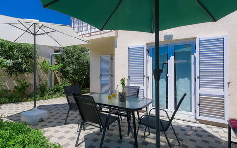 Gojak: Plant, Furniture, Property, Building, Table, Chair, Umbrella, Shade, Green, Outdoor Furniture