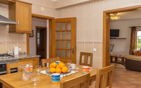 Das Amendoeiras: Table, Furniture, Tableware, Cabinetry, Couch, Chair, Orange, Wood, Interior Design, Food