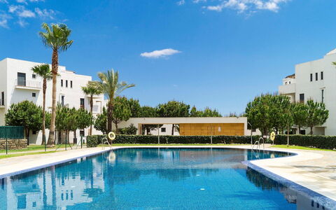 Alamar: Cloud, Water, Plant, Sky, Swimming Pool, Building, Tree, Azure, Leisure, Outdoor Furniture