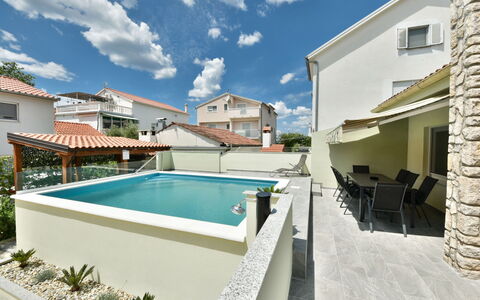 Goga: Cloud, Water, Building, Sky, Window, Swimming Pool, Plant, Chair, Shade, House