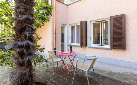 Ronco Sopra Ascona 75: Window, Building, Property, Plant, Furniture, Table, Chair, Wood, Outdoor Furniture, Flowerpot