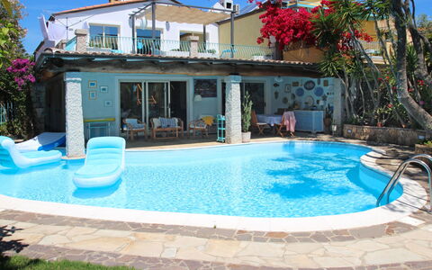Surphinia: Property, Swimming Pool, House, Building, Real Estate, Backyard, Town, Villa, Vacation, Home
