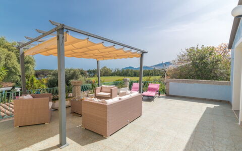 Surphinia: Sky, Building, Cloud, Plant, Table, Shade, House, Outdoor Furniture, Outdoor Table, Tree