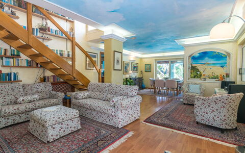 Surphinia: Couch, Furniture, Azure, Lighting, Architecture, Living Room, Wood, Floor, Flooring, Chair