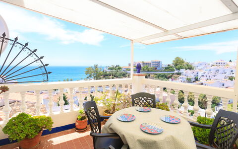 Nerja Penthouse: Table, Plant, Furniture, Property, Sky, Chair, Building, Cloud, Flowerpot, Shade