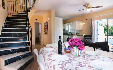 Villa Pueblo Jara: Table, Furniture, Property, Tableware, Ceiling Fan, Flower, Stairs, Decoration, Lighting, Tablecloth