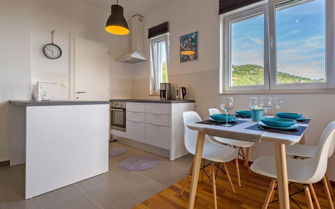 Novi Vinodolski Klenovica 104: Property, Cabinetry, Furniture, Countertop, Table, Window, Chair, Wood, Lighting, Interior Design