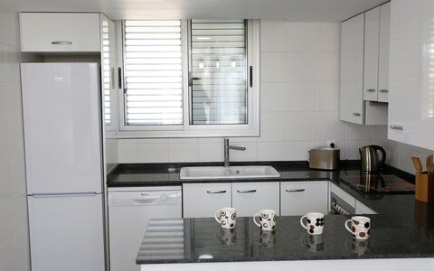L'Ampolla 652: Room, Property, Kitchen, Countertop, Cabinetry, Furniture, Interior Design, Building, Kitchen Stove, Major Appliance