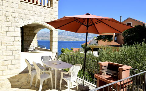 Villa Bay View: Plant, Sky, Table, Furniture, Property, Building, Chair, Shade, Umbrella, Outdoor Furniture