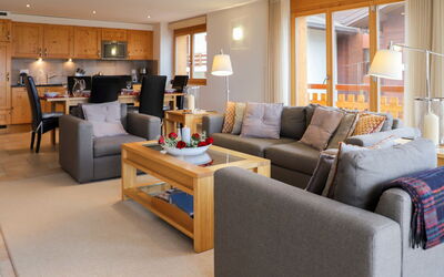 Cor des Alpes 16 681.3: Couch, Furniture, Table, Living Room, Comfort, Picture Frame, Orange, Studio Couch, Lighting, Chair