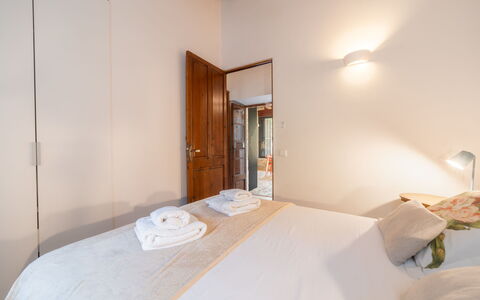 Can Coll: Bed, Interior Design, Bedroom, Floor, Flooring, Wood, Ceiling, Bed Sheet, Room, Bedding