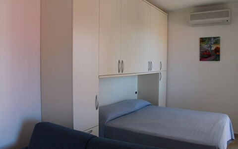 Scarlino Summer Village: Bed, Room, Furniture, Bedroom, Property, Bed Sheet, Bed Frame, Building, Mattress, Floor