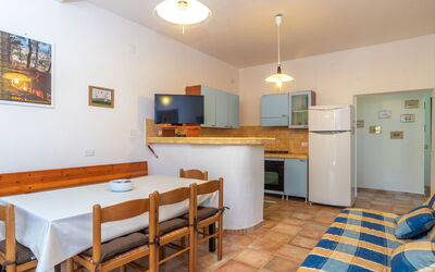 Villa Katia 710.1: Furniture, Cabinetry, Table, Countertop, Chair, Kitchen Appliance, Wood, Interior Design, Picture Frame, Kitchen