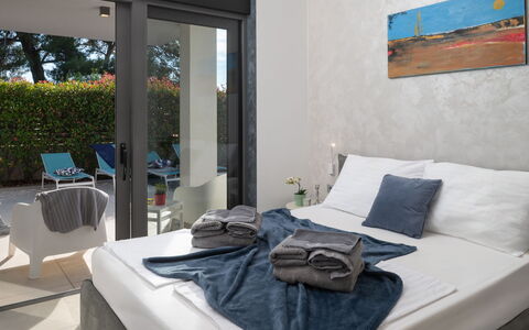 Villa Fasana: Furniture, Interior Design, Floor, Flooring, Chair, Room, Throw Pillow, Pillow, Bedroom, Bed