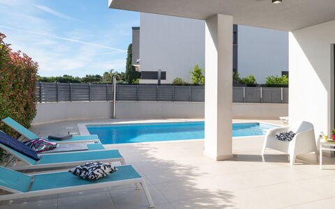 Villa Fasana: Swimming Pool, Interior Design, Flooring, Outdoor Furniture, Floor, Composite Material, Shade, Chair, Apartment, Resort