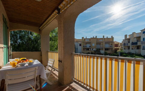Cavalaire 460: Sky, Cloud, Table, Building, Window, Porch, Wood, Shade, Chair, Floor