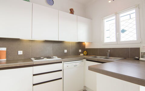 Cavalaire 505: Countertop, Property, Room, Kitchen, Cabinetry, Furniture, Interior Design, Building, Yellow, House
