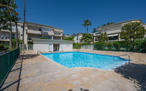 Eden Cap: Water, Sky, Property, Plant, Building, Cloud, Swimming Pool, Tree, Residential Area, Grass