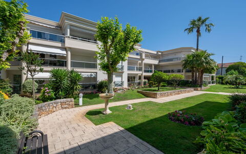 Eden Cap: Water, Sky, Property, Plant, Building, Cloud, Swimming Pool, Tree, Residential Area, Grass
