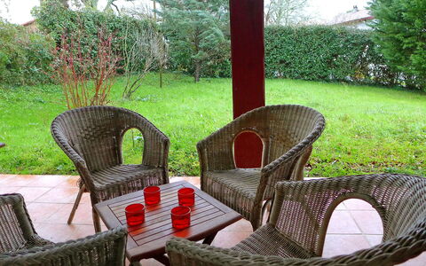 Eki Alde: Wicker, Furniture, Property, Chair, Table, Grass, Tree, Outdoor Furniture, House, Room