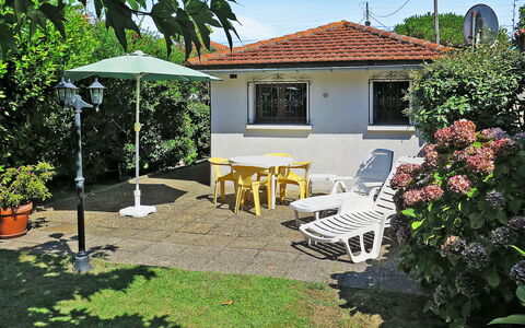 La Poste: Plant, Property, Sky, Building, Tree, Shade, Chair, Outdoor Furniture, House, Window