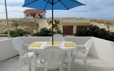 Mimizan 314: Property, Umbrella, Furniture, Table, Real Estate, House, Outdoor Table, Building, Shade, Patio