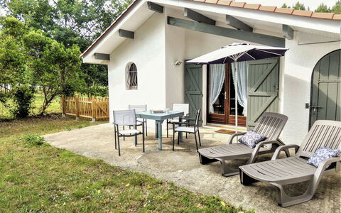 Le Fournil: Furniture, Plant, Building, Shade, Tree, Land Lot, Sky, Cottage, Chair, Residential Area