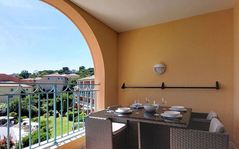 Les Issambres 125: Apartment, Balcony, Wood Stain, Chair, Shade, Varnish, Kitchen & Dining Room Table, Countertop, Houseplant, Villa