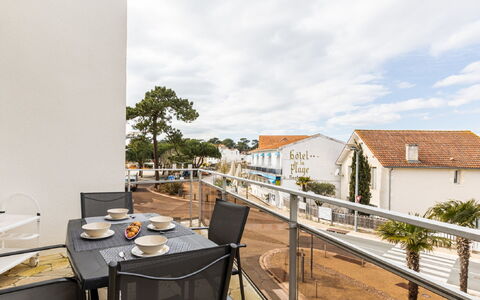 Les Adichats: Sky, Cloud, Table, Property, Building, Plant, Chair, Wood, Architecture, Tree