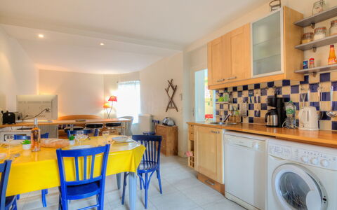 Petit Acacia: Furniture, Cabinetry, Laundry Room, Table, Building, Countertop, Chair, Kitchen, Home Appliance, House