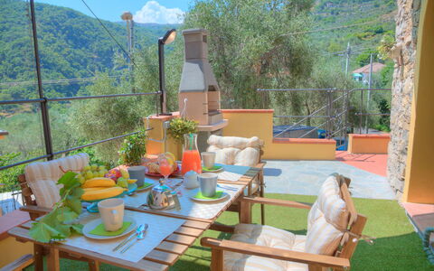 House of Stone - Deglio Faraldi: Property, House, Room, Table, Real Estate, Patio, Vacation, Furniture, Backyard, Home