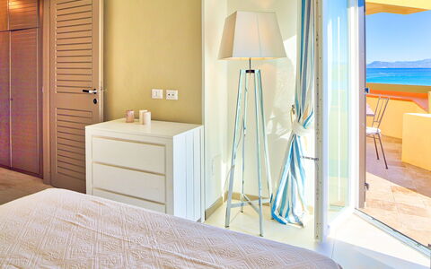 Golfo Aranci Ortensia Apartments: Room, Furniture, Property, Interior Design, Bedroom, Floor, Bed, Suite, Yellow, Bathroom