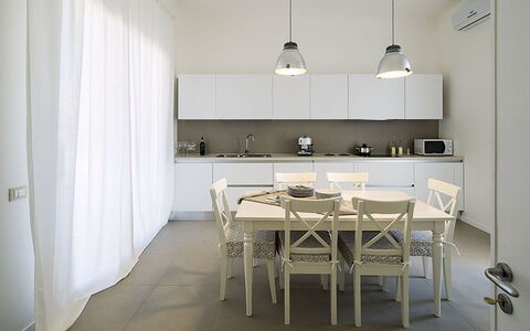 Villa Berbaro: Cabinetry, Furniture, Table, Wood, Countertop, Interior Design, Kitchen, Building, Chair