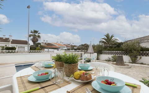 Marina: Cloud, Sky, Tableware, Table, Food, Plant, Furniture, Property, Dishware, Cup