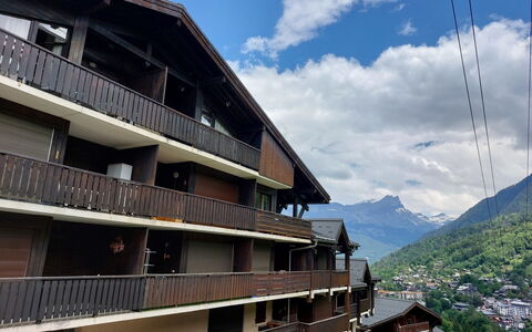Saint-Gervais D'En Haut: Sky, Cloud, Building, Mountain, Window, Urban Design, Wood, Landmark, Facade, Landscape