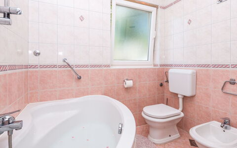 Silva: Bathroom, Property, Room, Bathtub, Tap, Wall, Tile, Pink, Plumbing Fixture, Architecture