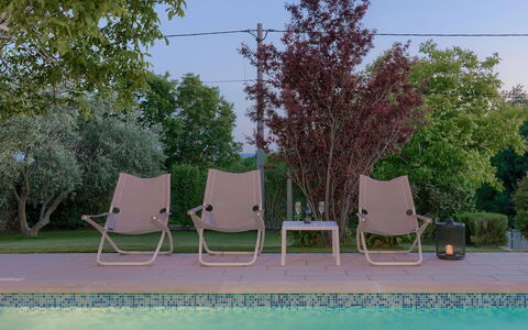 Chiara: Water, Sky, Furniture, Plant, Tree, Outdoor Furniture, Shade, Chair, Natural Landscape, Rectangle